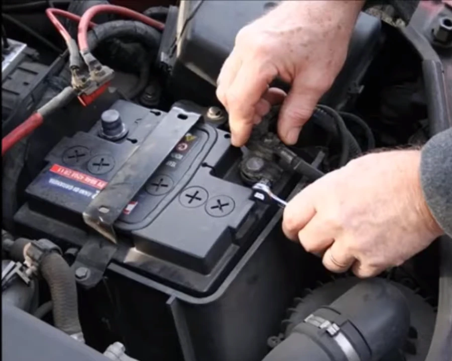Tightening the battery terminal after a car battery replacement