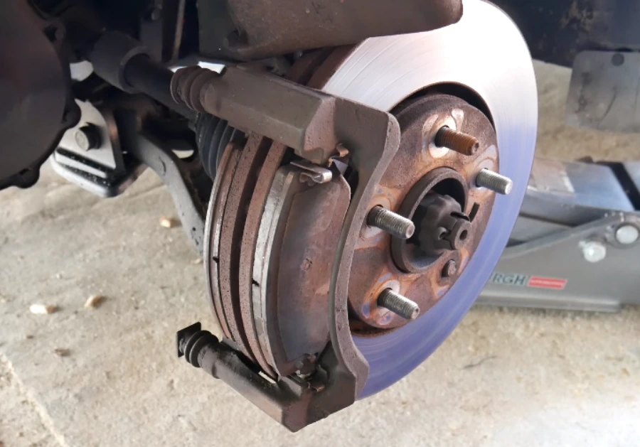 Front brake rotor and caliper with the wheel removed for inspection