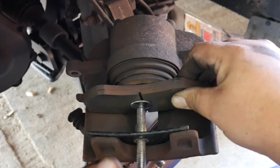 Installing new brake pads into the caliper