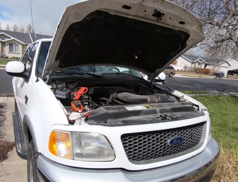 Ford pickup with the hood up for a no-start diagnosis in a Lubbock driveway