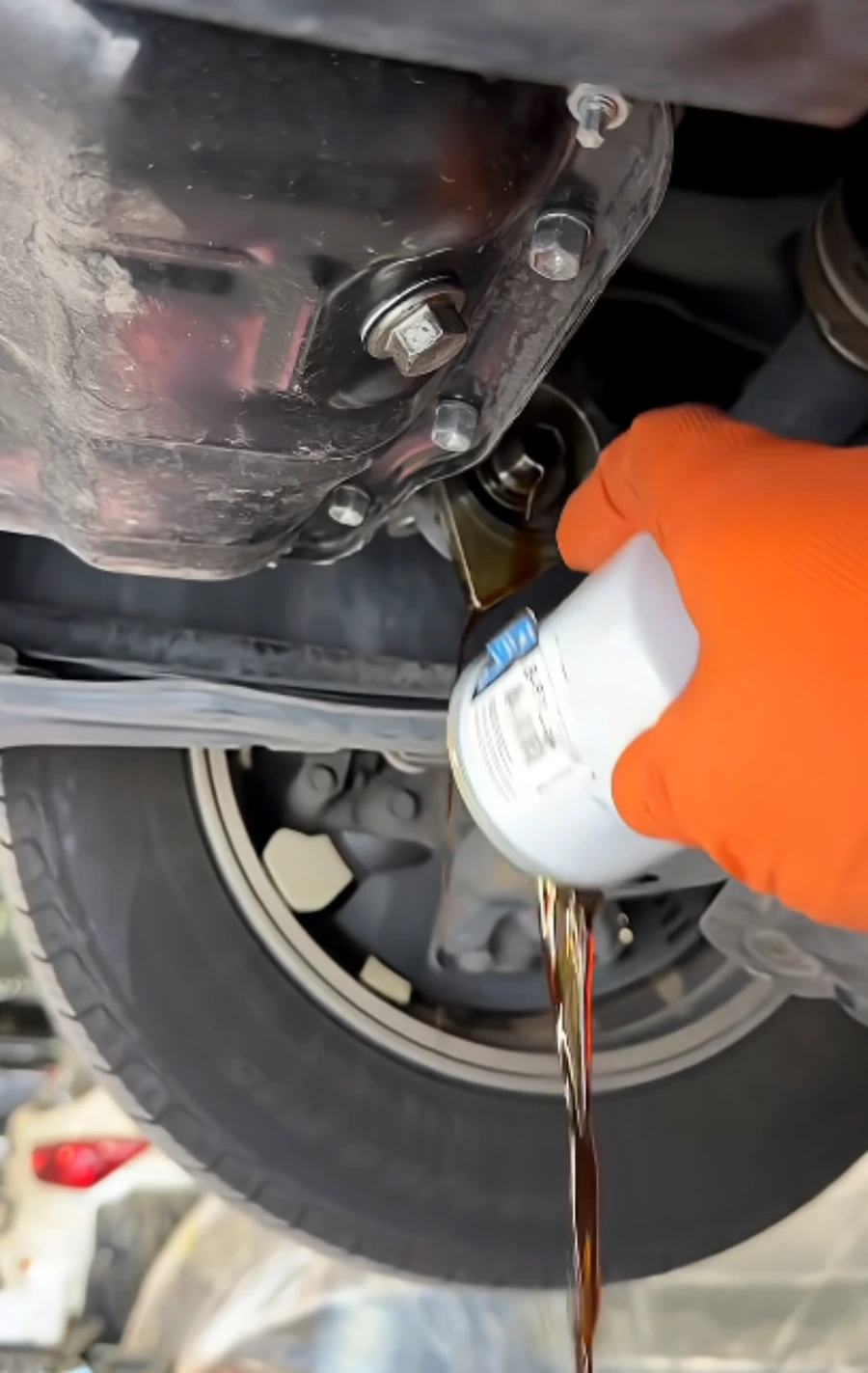 Mobile oil change underneath a vehicle in Lubbock
